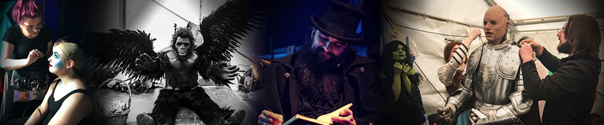 A winged monkey, a man with a book writes in the darkness